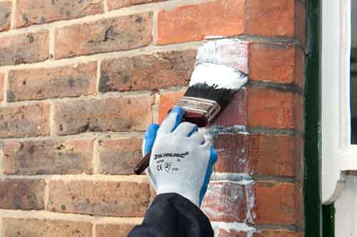 Use a brush to apply around details such as windows